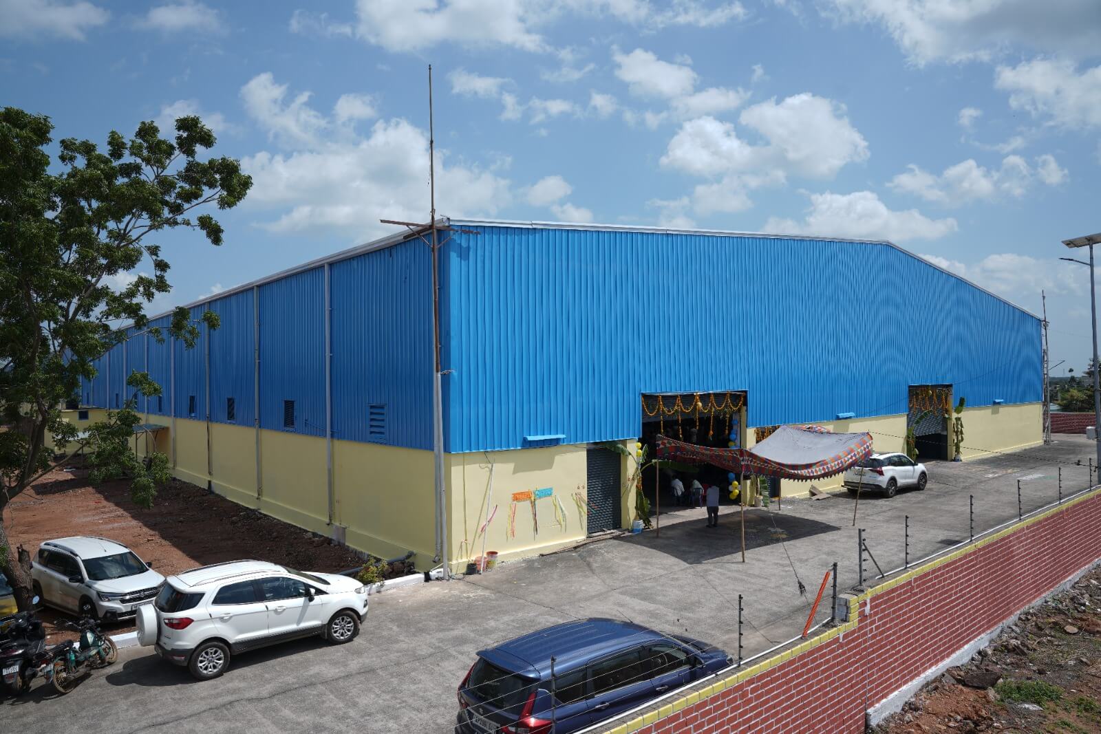 TRBL manufacturing plant side view with parking